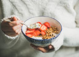 fresh fruit and berries with yogurt and granola