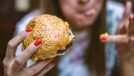 woman eating a hamburger